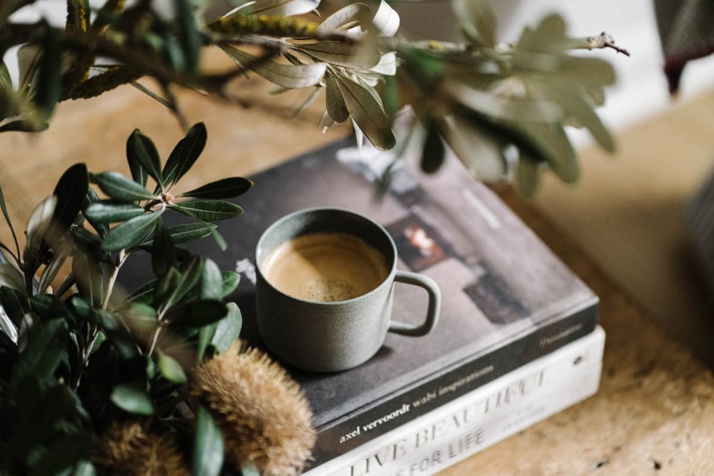 The Branded Coffee Co Coffee Cup On Book